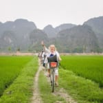 Riding bike on countryside at tam coc mua cave tour